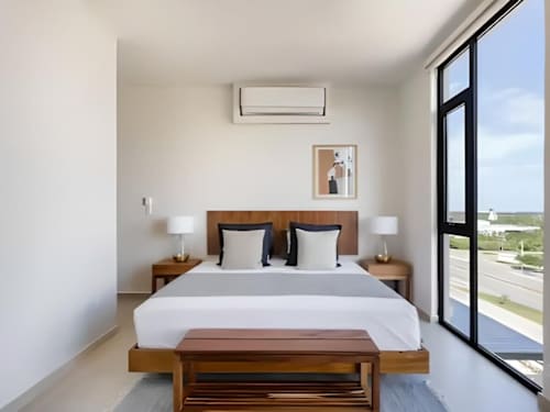 King bedroom with balcony and lagoon views