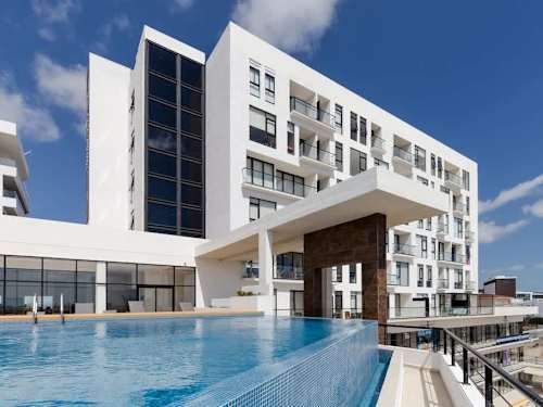 Shared rooftop pool and building exterior