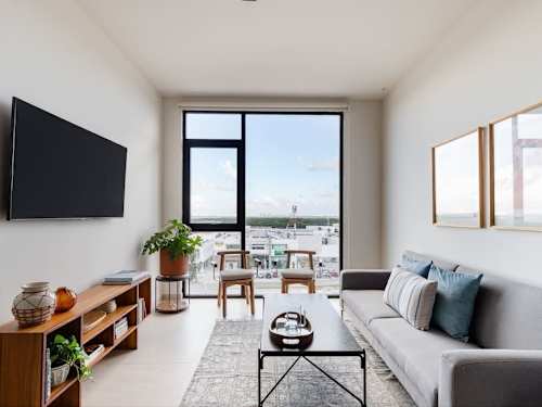 Bright living room with lagoon view