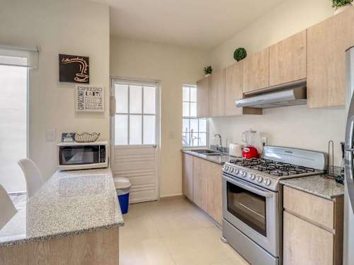 Fully equipped kitchen with stove and oven