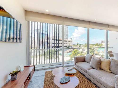 Living area with sofa and balcony