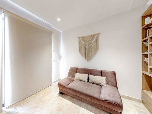 Studio with bed and shelving