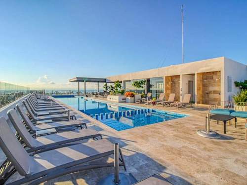 Rooftop pool deck and loungers (shared)