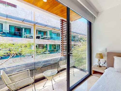 Private balcony with seating and open town views