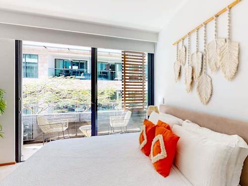Private balcony with lounge seating and plants