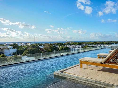 Shared rooftop pool with ocean views