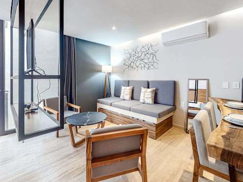 Bright living room with sofa and balcony
