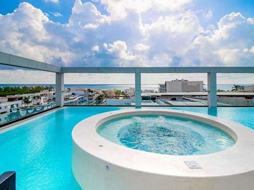 Shared rooftop pool with hot tub