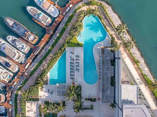 Aerial view of the complex with shared pool and water features