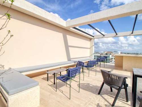 Shared rooftop terrace seating with views