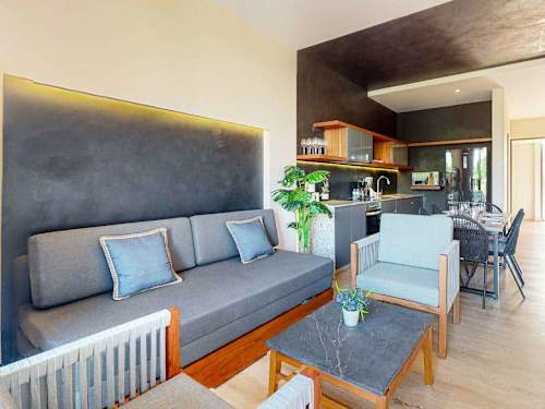 Open living and dining area with sofa bed