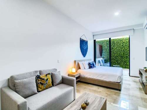 Open-plan studio with bed and living area