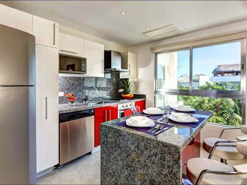 Open kitchen and living area with balcony