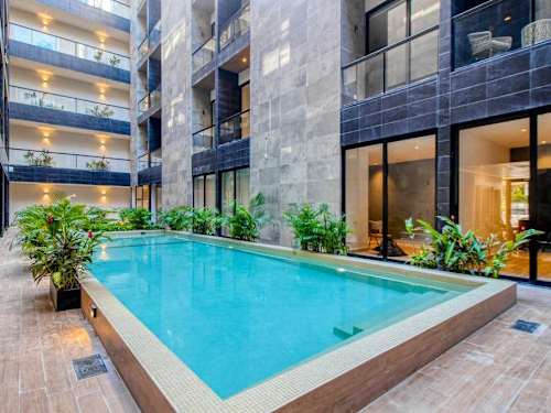 Shared rooftop pool with sun deck