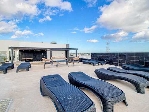 Shared rooftop sun loungers