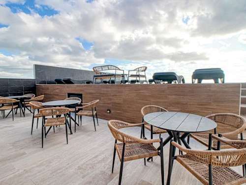 Shared rooftop lounge and dining area