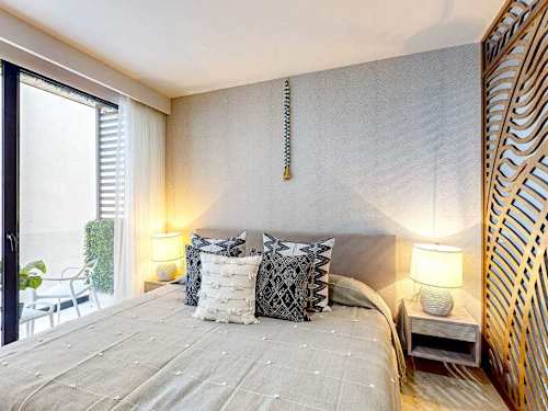 King bed with access to the private balcony