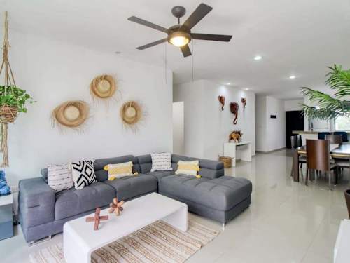 Living area with sofa and ceiling fan