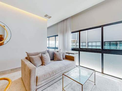 Bright living room with floor-to-ceiling windows
