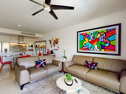 Living room with colorful art and comfortable seating