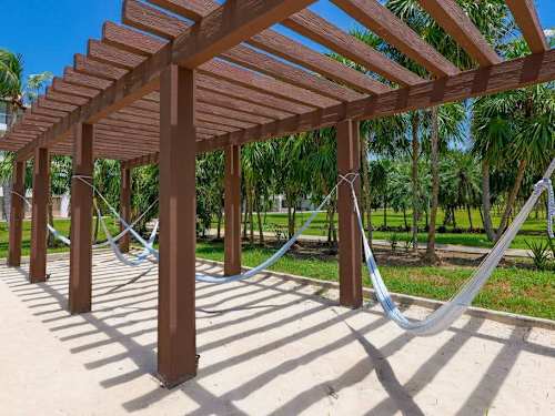Shared pergola and hammock lounge area