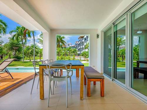 Living area with glass doors opening to the terrace