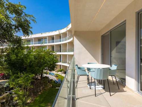 Balcony overlooking the shared pool and gardens