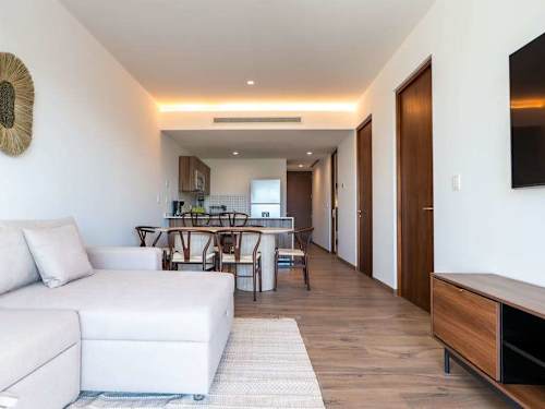 Open living room with adjoining kitchen