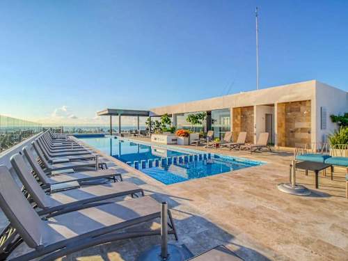 Shared rooftop pool lounge and cabana area