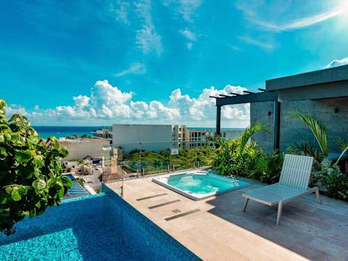 Shared rooftop pool with ocean view