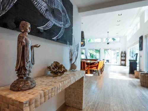 Bright living area with large windows and high vaulted ceilings