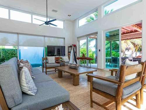 Open-plan living and dining area with double-height ceilings