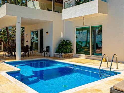 Villa and private pool at dusk