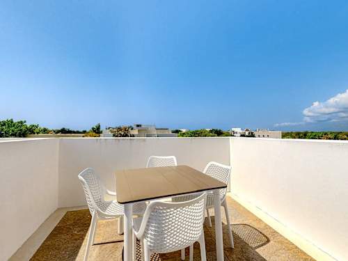Shared rooftop pool with ocean views