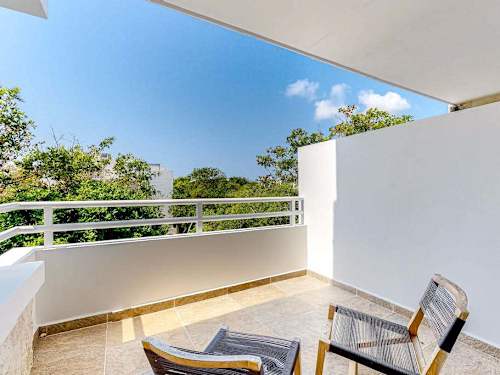 Private balcony with seating and ocean breeze