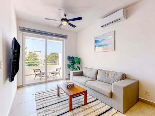 Bright living room with balcony access