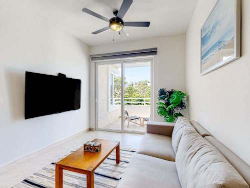 Living room with smart TV and ceiling fan