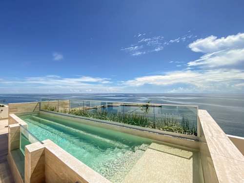Rooftop infinity pool over the Caribbean