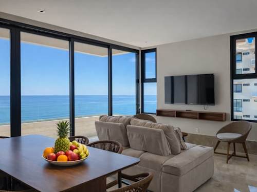 Living area with floor-to-ceiling ocean views