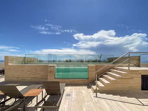 Rooftop infinity pool over the Caribbean