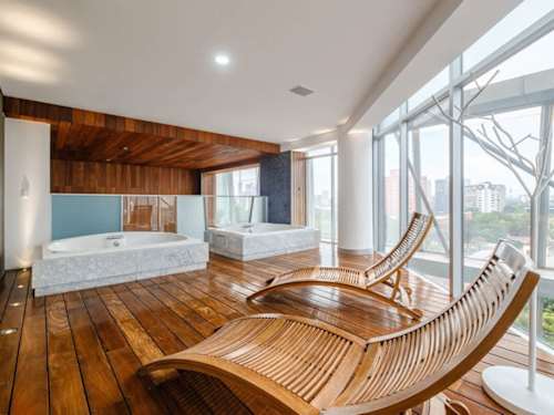 Spa-style relaxation nook with wooden loungers, unwind and recharge without leaving the building