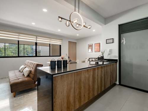 Sleek open kitchen with a central island, everything flows for cooking and gathering