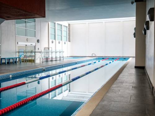 Sleek indoor lap pool on site, swim laps year-round without leaving the building