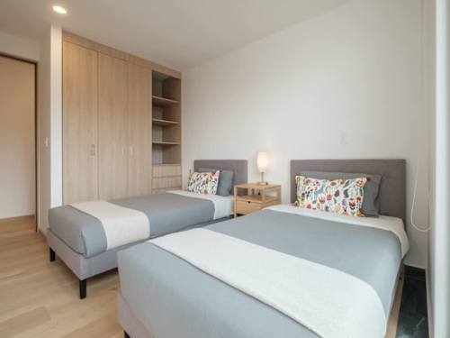 Comfortable second bedroom with twin beds, a great fit for kids or friends traveling together