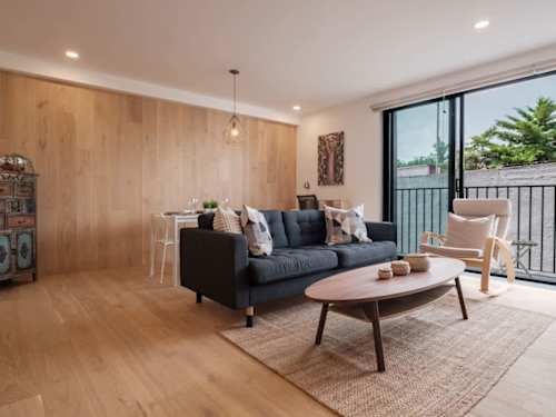Bright, open living area with a comfy sofa opening to the balcony, relaxed family living near Parque Mexico