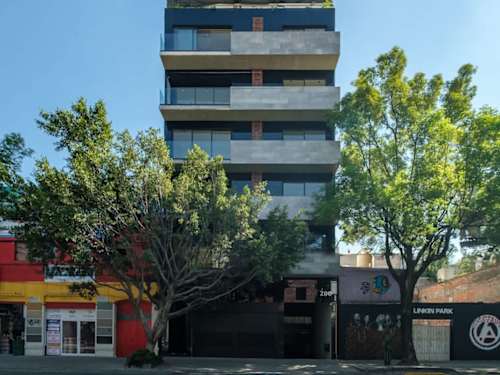 Sleek modern building facade in Roma Norte, steps from the cafes, galleries and tree-lined streets the area is loved for