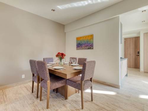 Inviting dining nook set for a shared meal, gather with friends after a day exploring Roma Norte