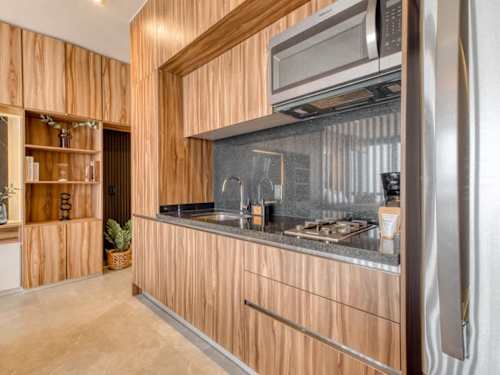Modern kitchen with wood cabinetry and stainless appliances, everything you need to cook in