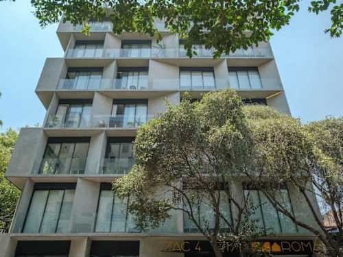 Sleek modern building facade in the heart of Roma Norte, steps from the cafes, galleries and tree-lined streets