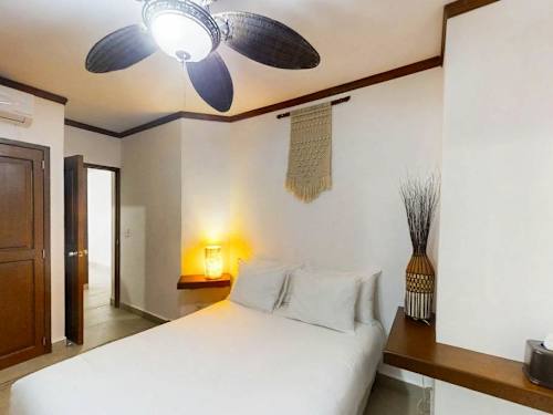 Bedroom with nightstand and reading lamp